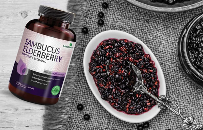 Supplements on table with bowl of elderberry