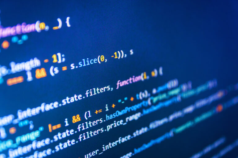 Coded data on monitor. Program code and visual UI/UX. Running Computer data / WWW programming. Software and PHP and field. Web programming functions on laptop.
