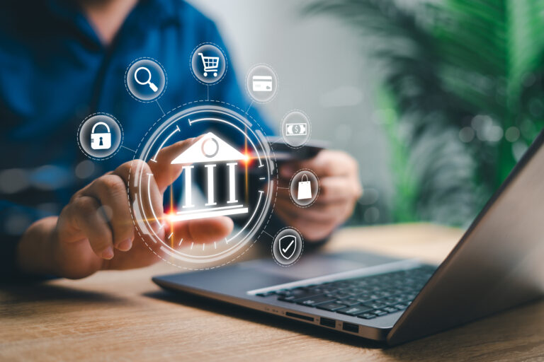 Cyber Digital banking internet payment online shopping and financial technology concepts, Businessman use laptops and hold credit card pay via mobile banking for online shopping technology icons