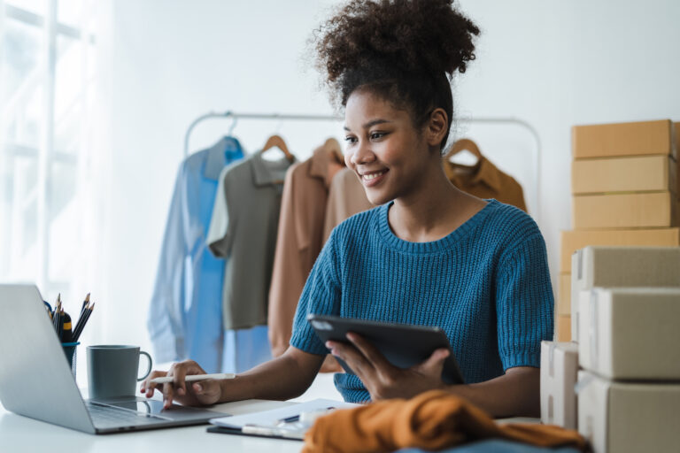 Woman start up small business owner at workplace. small business entrepreneur SME or freelance asian woman working with box at home.