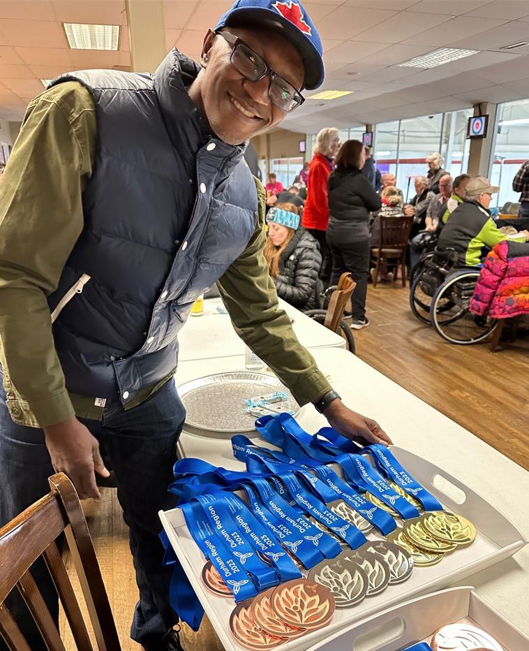 Isaac showing medals